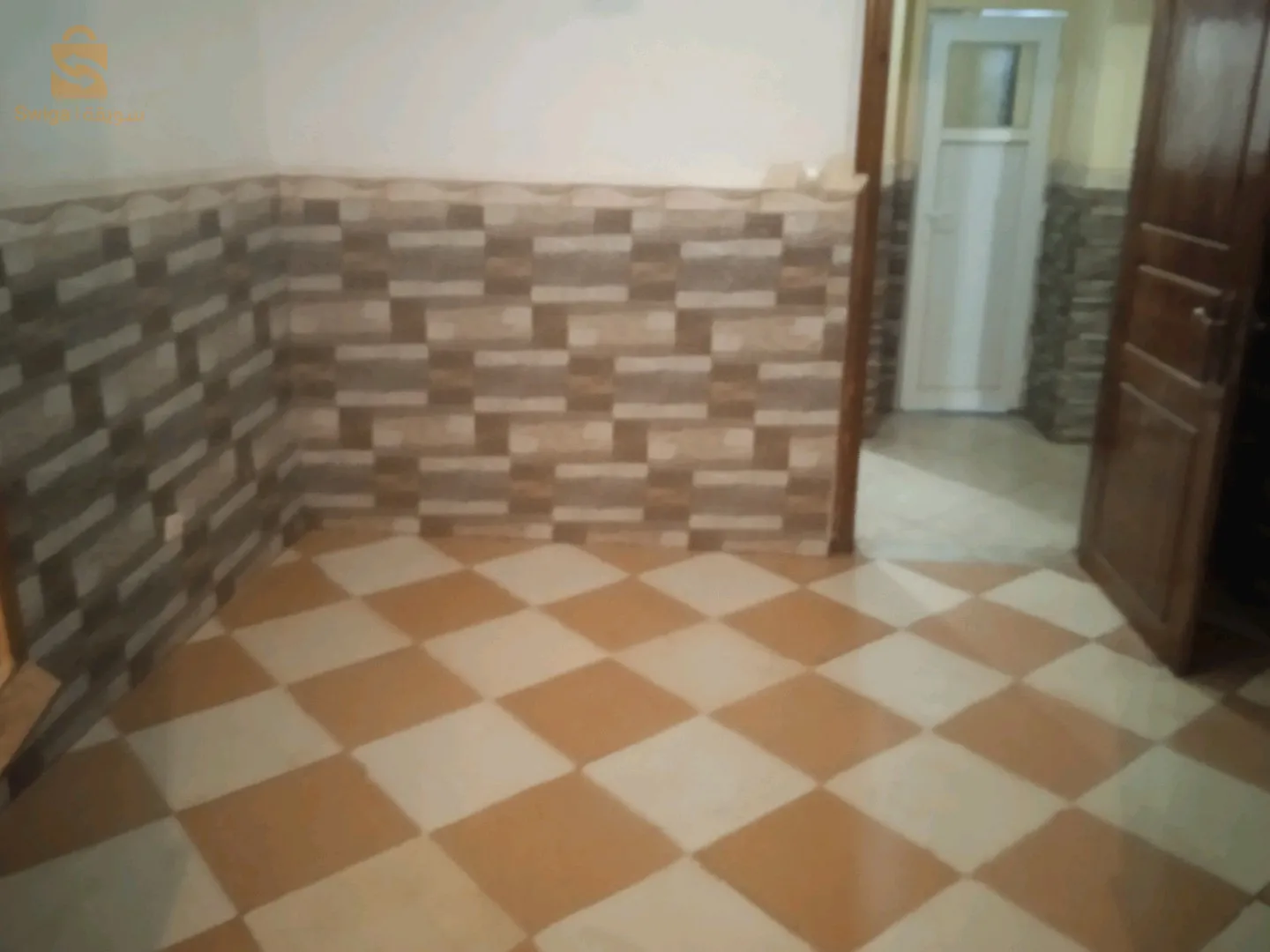 حي 200مسكن تساهمي سيدي عيسى