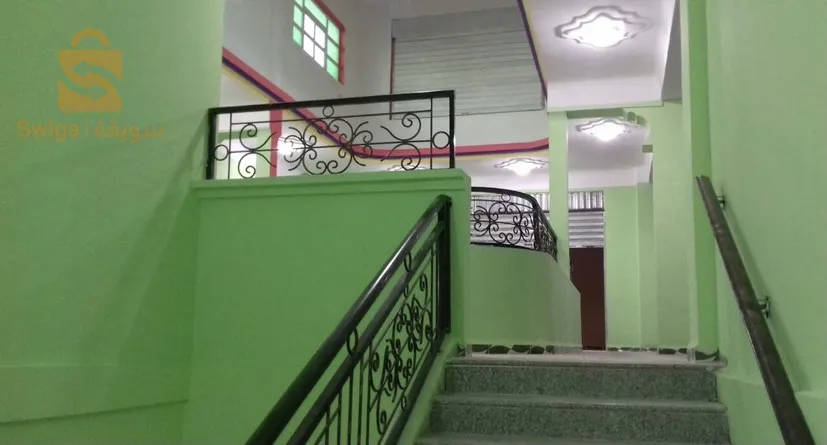 Shopping center for sale.
 
 Large finished establishment with an area of ​​560 m2, located in Ain Beida 150 meters from the Zerdani hospital in Aïn Beïda/Algeria, in the street of Khenchela. The room can be converted into multiple commercial activities.

The center is made up of:
1- two floors with an exercise area of ​​950 m2.
2- Underground parking giving access to retail areas and providing parking for 20 cars for employees and/or customers of the centre.
3- Locker rooms with two sinks and two toilets on each floor of the center.
4- A prayer room with a maidha on the 1st floor.
5- An electrical room (Electrical room for main meter and junction boxes).

The mall is provided by the following amenities.
- Electricity: 220v and 380v depending on the electrical voltage of the needs of the center.
- Water: 3 networks available, drinking water with 8,000 liter tanks, service water and fire protection line with a 10,000 liter water tank fed by an underground water table (always full).
A main entrance Hall 5m wide leading to an area of ​​8x7 meters as free space. A secure opening of 7x5 meters in the roof of the central hall for ventilation and light.
Double entrance on two opposite facades.
- Main entrance: double doors with an electric curtain.
- A large door facilitating access to premises/offices and commercial areas from the rear of the building (180 degrees opposite the main door) and connecting the northern districts to the center.

The center is very well located.
Details :
City: Ain Beida, promoted wilaya, Khenchela street, 150 meters from Ain Beida hospital, facing the national street No. 80.

NB:
ANY MODIFICATIONS TO THE CENTER TO MEET THE NEEDS OF THE SPECIALTY IS AUTHORIZED.

https://youtu.be/DqH_X5FdxuE?si=X6XLquroxkWQazYd