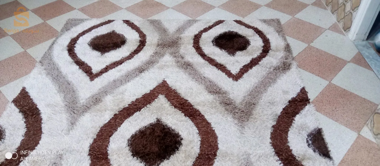 tapis gazoné en très bonne état 2×2.9 mètres