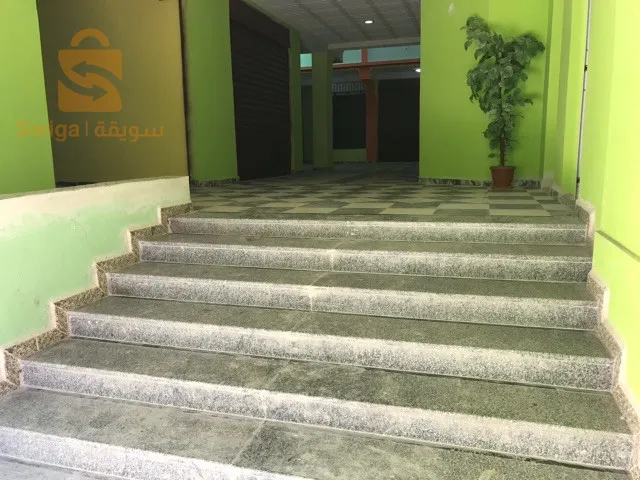 Shopping center for sale.
 
 Large finished establishment with an area of ​​560 m2, located in Ain Beida 150 meters from the Zerdani hospital in Aïn Beïda/Algeria, in the street of Khenchela. The room can be converted into multiple commercial activities.

The center is made up of:
1- two floors with an exercise area of ​​950 m2.
2- Underground parking giving access to retail areas and providing parking for 20 cars for employees and/or customers of the centre.
3- Locker rooms with two sinks and two toilets on each floor of the center.
4- A prayer room with a maidha on the 1st floor.
5- An electrical room (Electrical room for main meter and junction boxes).

The mall is provided by the following amenities.
- Electricity: 220v and 380v depending on the electrical voltage of the needs of the center.
- Water: 3 networks available, drinking water with 8,000 liter tanks, service water and fire protection line with a 10,000 liter water tank fed by an underground water table (always full).
A main entrance Hall 5m wide leading to an area of ​​8x7 meters as free space. A secure opening of 7x5 meters in the roof of the central hall for ventilation and light.
Double entrance on two opposite facades.
- Main entrance: double doors with an electric curtain.
- A large door facilitating access to premises/offices and commercial areas from the rear of the building (180 degrees opposite the main door) and connecting the northern districts to the center.

The center is very well located.
Details :
City: Ain Beida, promoted wilaya, Khenchela street, 150 meters from Ain Beida hospital, facing the national street No. 80.

NB:
ANY MODIFICATIONS TO THE CENTER TO MEET THE NEEDS OF THE SPECIALTY IS AUTHORIZED.

https://youtu.be/DqH_X5FdxuE?si=X6XLquroxkWQazYd