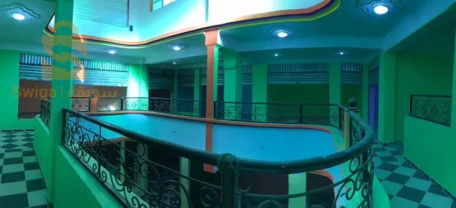 Shopping center for sale.
 
 Large finished establishment with an area of ​​560 m2, located in Ain Beida 150 meters from the Zerdani hospital in Aïn Beïda/Algeria, in the street of Khenchela. The room can be converted into multiple commercial activities.

The center is made up of:
1- two floors with an exercise area of ​​950 m2.
2- Underground parking giving access to retail areas and providing parking for 20 cars for employees and/or customers of the centre.
3- Locker rooms with two sinks and two toilets on each floor of the center.
4- A prayer room with a maidha on the 1st floor.
5- An electrical room (Electrical room for main meter and junction boxes).

The mall is provided by the following amenities.
- Electricity: 220v and 380v depending on the electrical voltage of the needs of the center.
- Water: 3 networks available, drinking water with 8,000 liter tanks, service water and fire protection line with a 10,000 liter water tank fed by an underground water table (always full).
A main entrance Hall 5m wide leading to an area of ​​8x7 meters as free space. A secure opening of 7x5 meters in the roof of the central hall for ventilation and light.
Double entrance on two opposite facades.
- Main entrance: double doors with an electric curtain.
- A large door facilitating access to premises/offices and commercial areas from the rear of the building (180 degrees opposite the main door) and connecting the northern districts to the center.

The center is very well located.
Details :
City: Ain Beida, promoted wilaya, Khenchela street, 150 meters from Ain Beida hospital, facing the national street No. 80.

NB:
ANY MODIFICATIONS TO THE CENTER TO MEET THE NEEDS OF THE SPECIALTY IS AUTHORIZED.

https://youtu.be/DqH_X5FdxuE?si=X6XLquroxkWQazYd