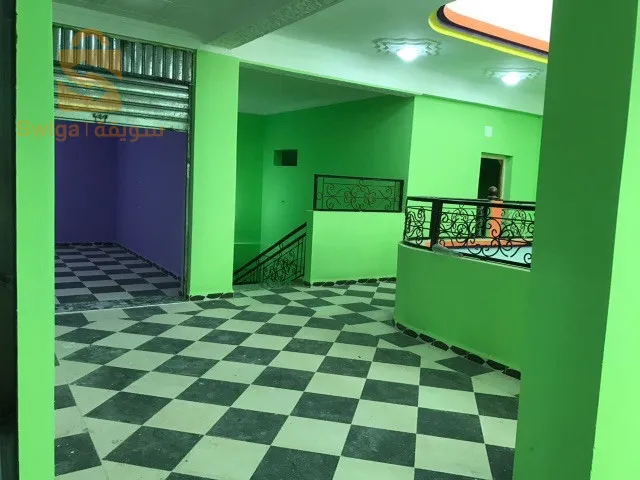 Shopping center for sale.
 
 Large finished establishment with an area of ​​560 m2, located in Ain Beida 150 meters from the Zerdani hospital in Aïn Beïda/Algeria, in the street of Khenchela. The room can be converted into multiple commercial activities.

The center is made up of:
1- two floors with an exercise area of ​​950 m2.
2- Underground parking giving access to retail areas and providing parking for 20 cars for employees and/or customers of the centre.
3- Locker rooms with two sinks and two toilets on each floor of the center.
4- A prayer room with a maidha on the 1st floor.
5- An electrical room (Electrical room for main meter and junction boxes).

The mall is provided by the following amenities.
- Electricity: 220v and 380v depending on the electrical voltage of the needs of the center.
- Water: 3 networks available, drinking water with 8,000 liter tanks, service water and fire protection line with a 10,000 liter water tank fed by an underground water table (always full).
A main entrance Hall 5m wide leading to an area of ​​8x7 meters as free space. A secure opening of 7x5 meters in the roof of the central hall for ventilation and light.
Double entrance on two opposite facades.
- Main entrance: double doors with an electric curtain.
- A large door facilitating access to premises/offices and commercial areas from the rear of the building (180 degrees opposite the main door) and connecting the northern districts to the center.

The center is very well located.
Details :
City: Ain Beida, promoted wilaya, Khenchela street, 150 meters from Ain Beida hospital, facing the national street No. 80.

NB:
ANY MODIFICATIONS TO THE CENTER TO MEET THE NEEDS OF THE SPECIALTY IS AUTHORIZED.

https://youtu.be/DqH_X5FdxuE?si=X6XLquroxkWQazYd