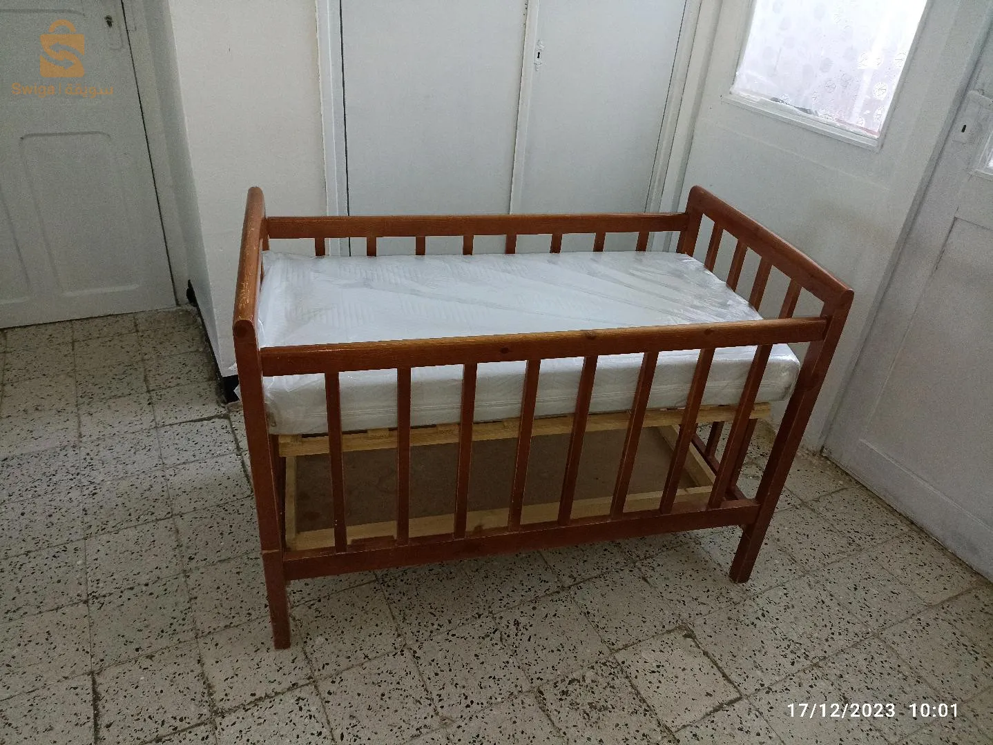 سرير اطفال و ماطلة