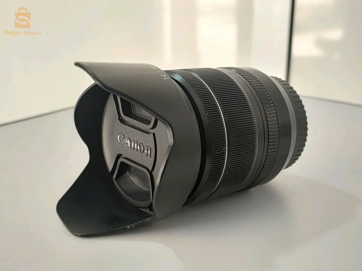 Fuji 18-55mm f2.8-4 avec parasolie et bouchons
L'état 10/10