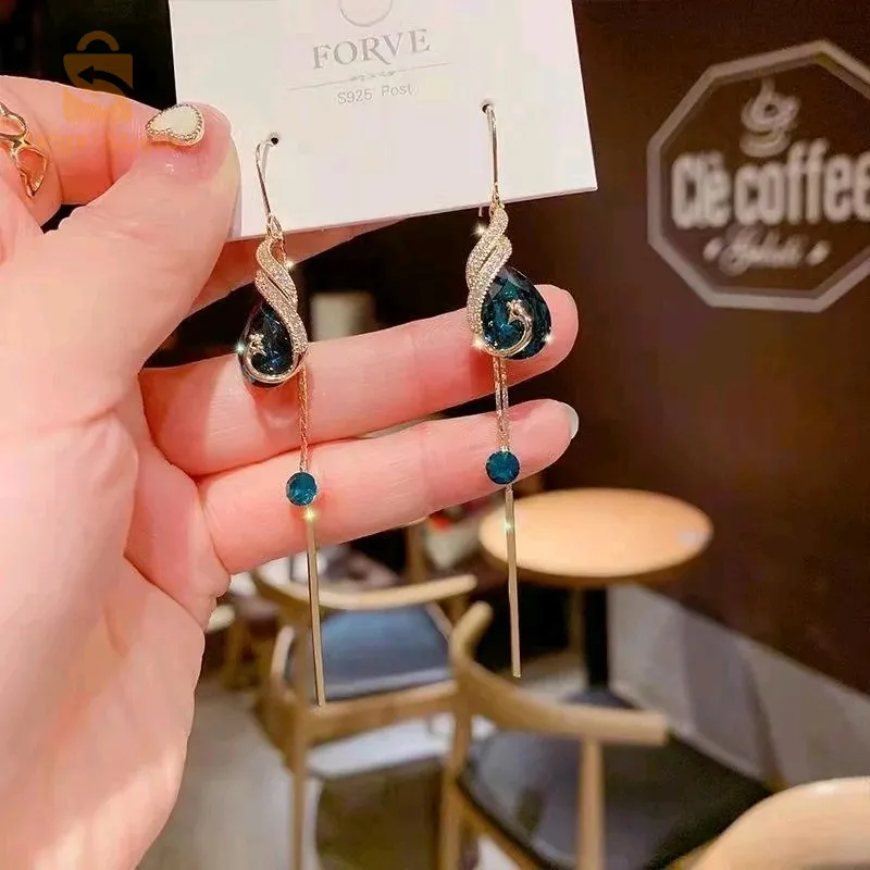 Boucle d'oreille paon