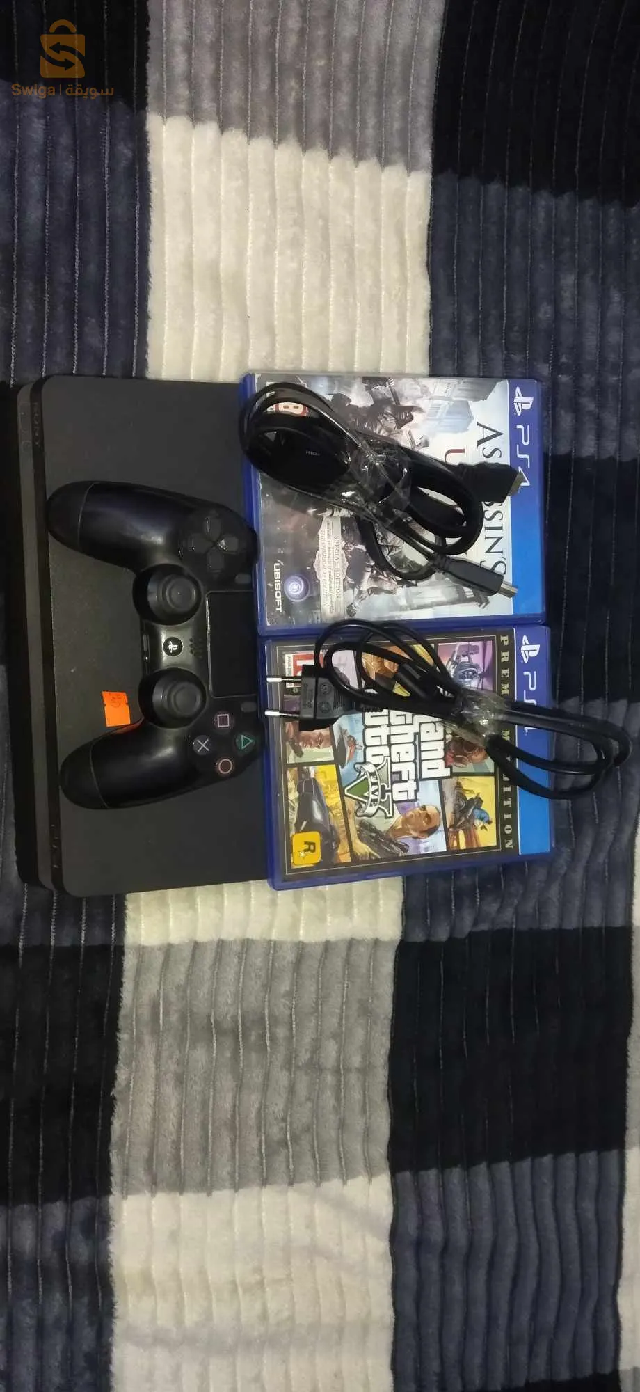 ps4 slim avec 1 mannete et cd gta 5 + cd assasin creed version 11.00 🎮