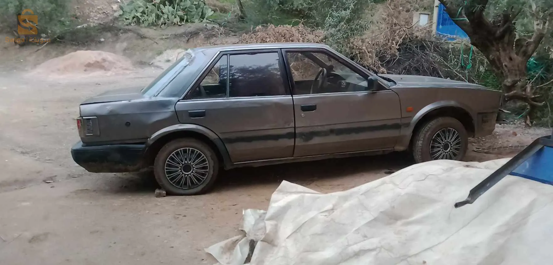 سيارة نيسان فيها متور فيات 75ايسونس و فيها الغاز لاسيسبونسيون جديدة متور مليح لاكسيدون والرشاوى مافيهاش يخصها البارشوك تاعها يتخدم