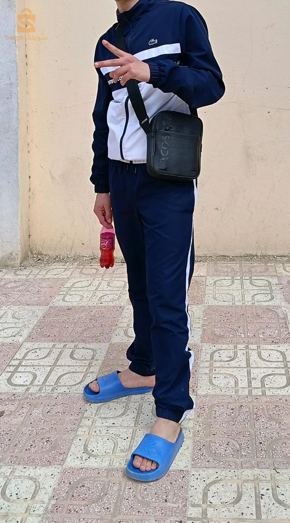 ملابس رياضية لاكوست