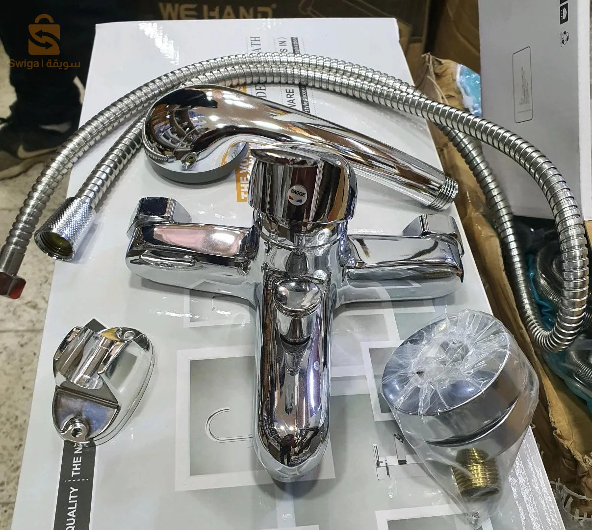 Bath mixer with hand shower