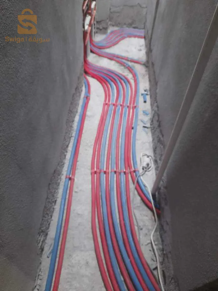 Installation de conduites d'eau, de gaz, d'égouts et de chauffage central