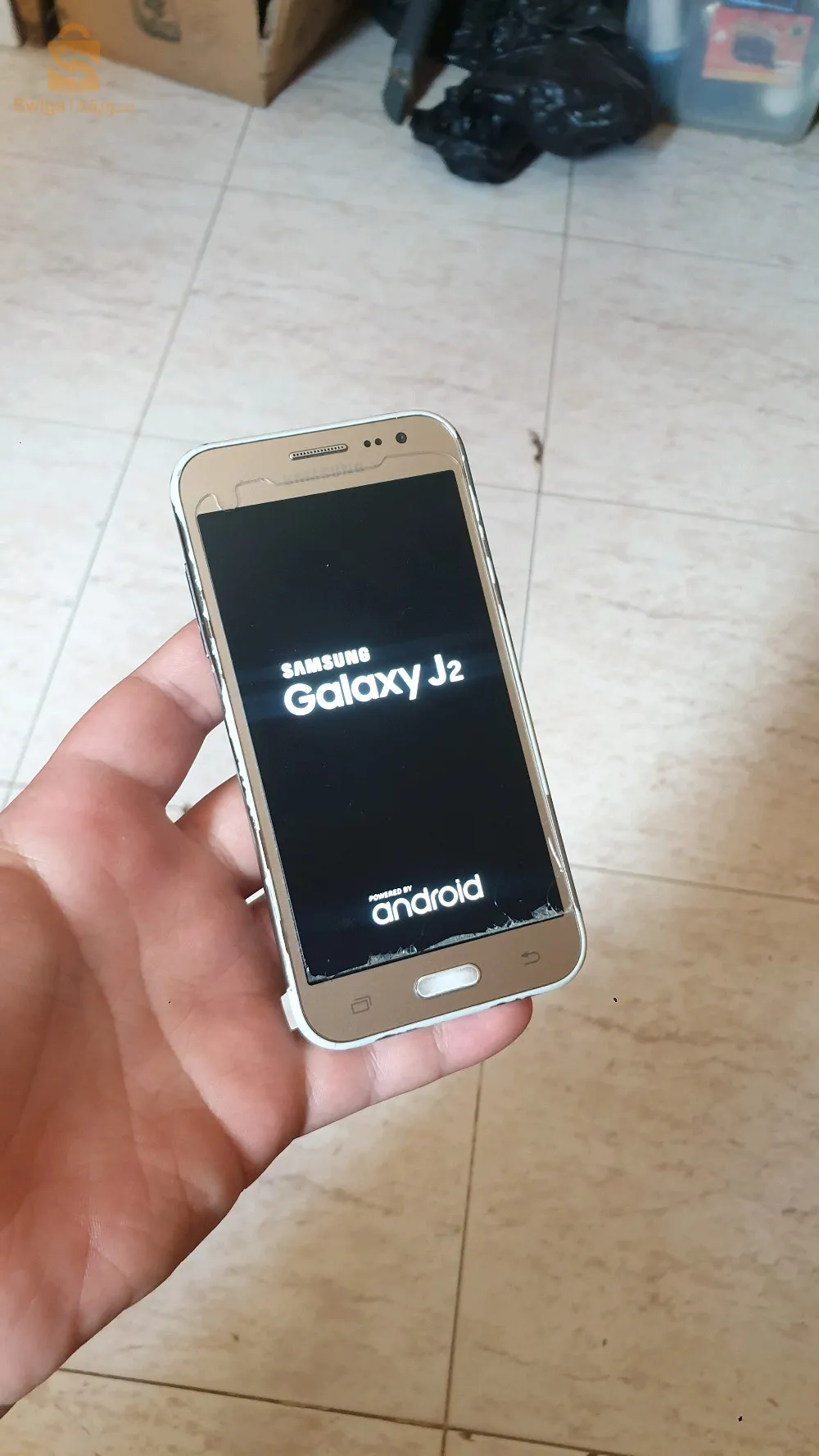 هاتف samsung galaxy j2  تيليفون ماشاء الله يخدم علامة في سطوكاج 8 و رام 1 دوبل بيس و كارت ميموار الباتري تشد مليح