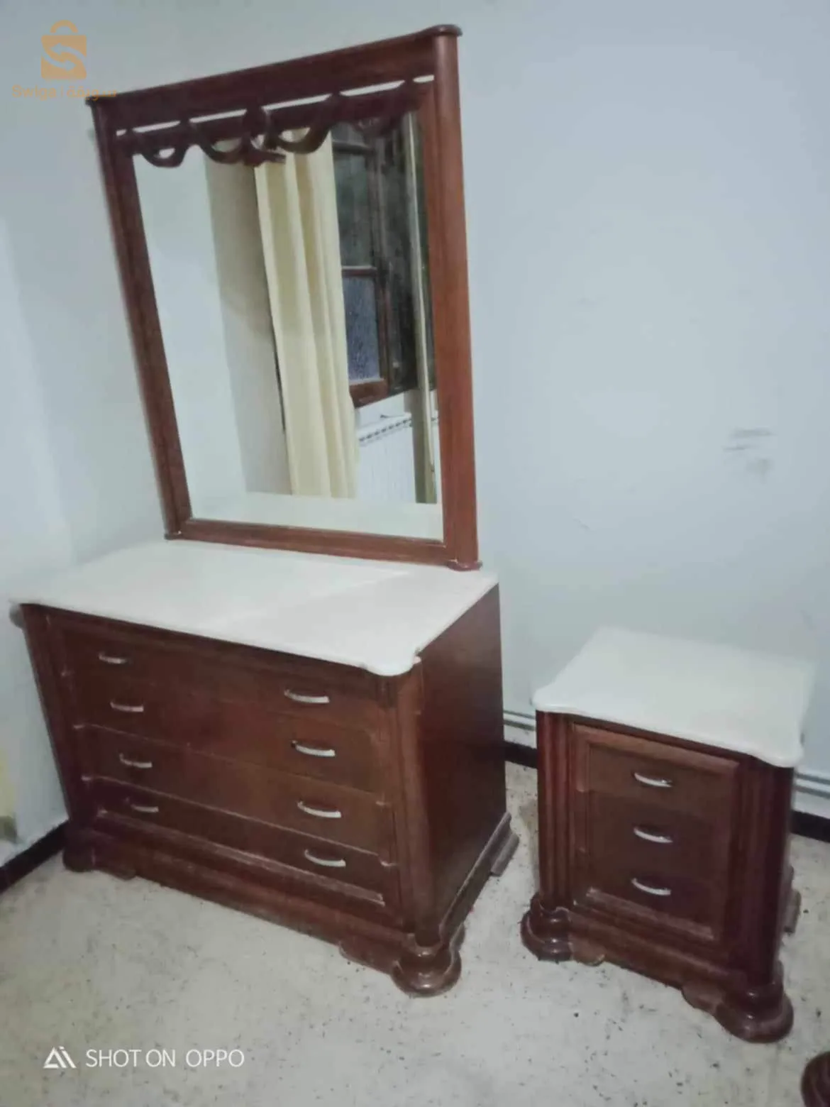 A bedroom dressed in wood hugs and also with a marble in the dressing table and everything!!!