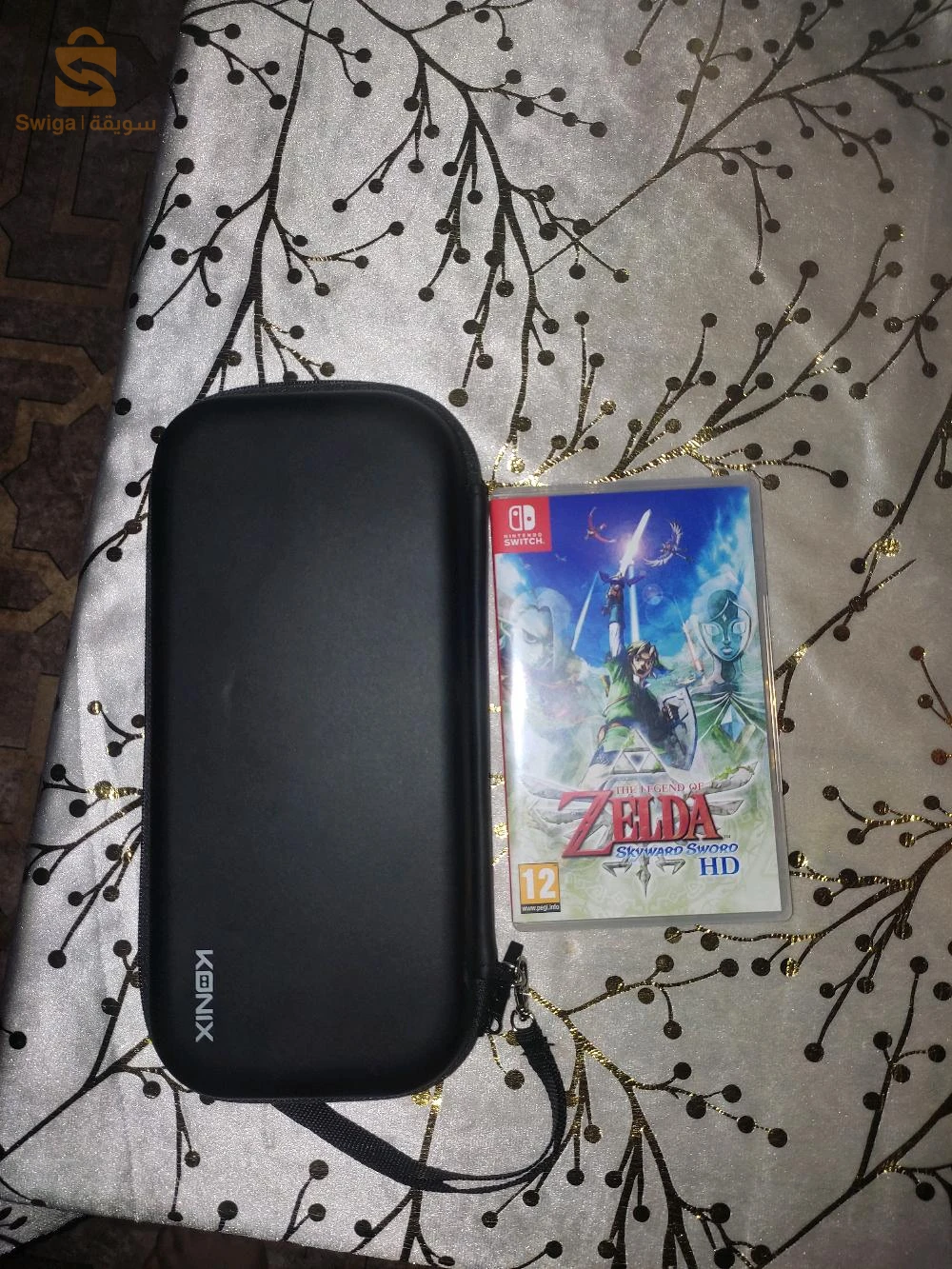 nitendo Switch Oled jamais utilisé avec cassette Zelda et pochette original