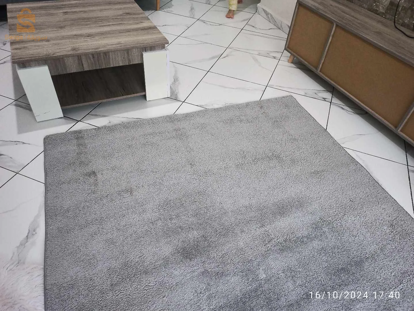 tapis presque neuf