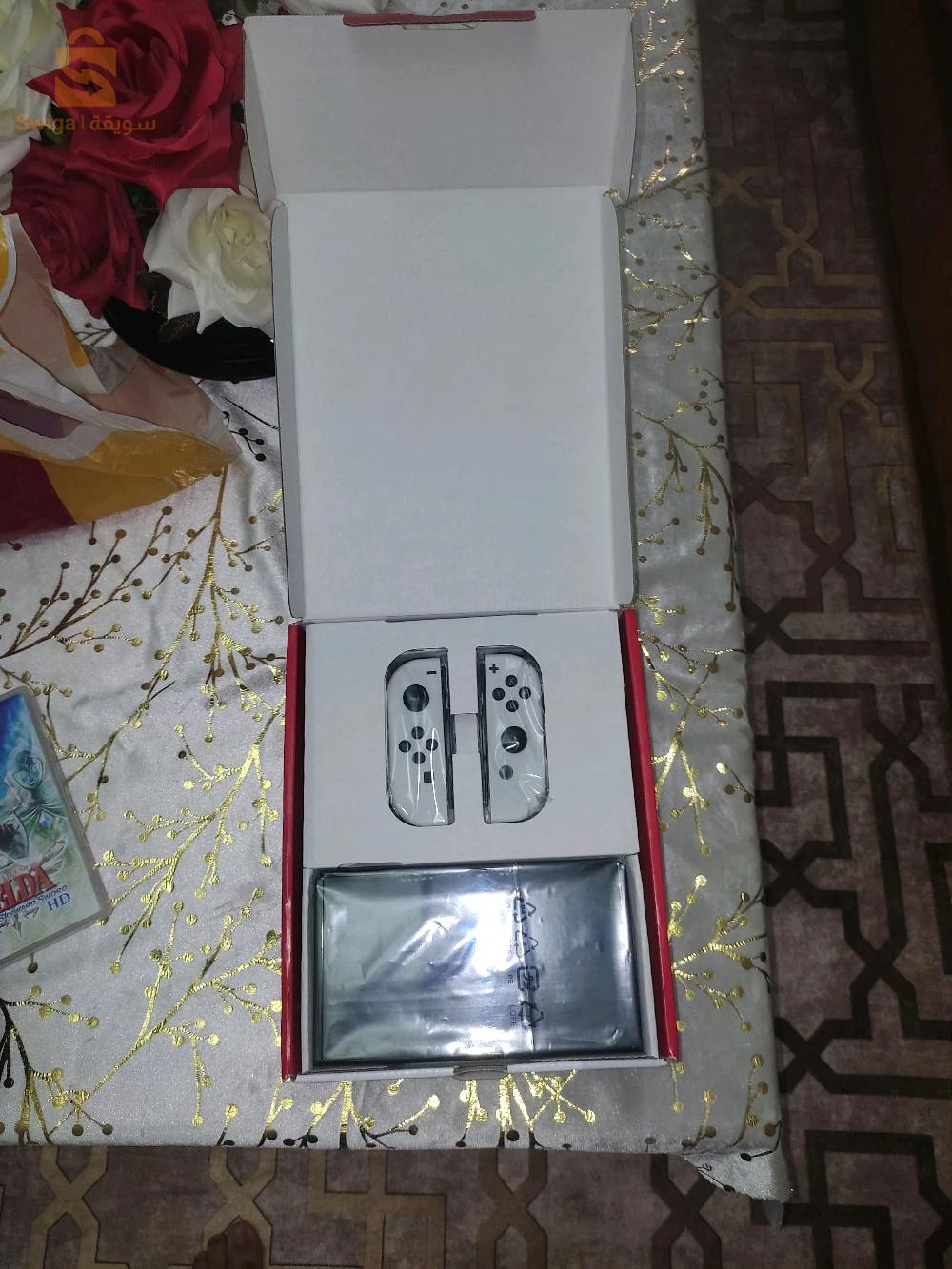 nitendo Switch Oled jamais utilisé avec cassette Zelda et pochette original