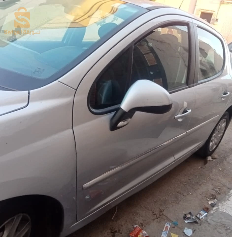 سيارة 207 نقية 0مصروف موتور مرفيزي قانون فيها راكور بارشوك افو و شوي افروا لال امام وباقي كلش منظم