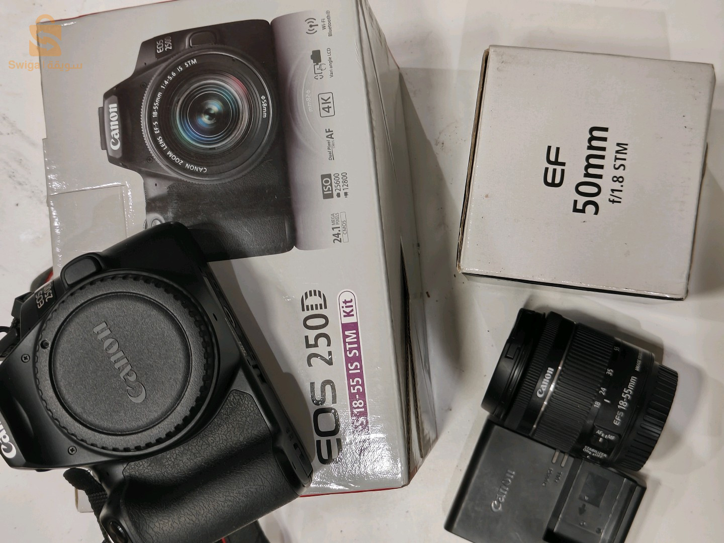 كانون 250d EOS  stm.kit مع اوبجكتيف 18/55m.m مع اوبجكتيف 50m.m f1.8 كلش اورجينال مع الباطة تاعها استعمال زوج خطرات برك