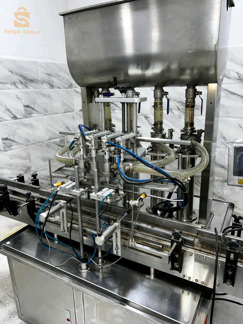 Rempliseuse 4 bec autamatique pour jus lait produi etergent champo et tt les produi likidكل أنواع السوائل M 100 ml.   1000 ml1200 boteil par heure