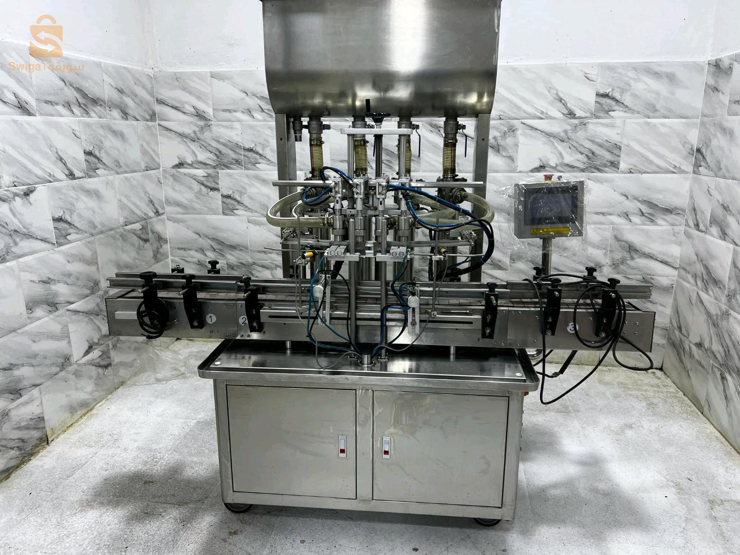 Rempliseuse 4 bec autamatique pour jus lait produi etergent champo et tt les produi likidكل أنواع السوائل M 100 ml.   1000 ml1200 boteil par heure