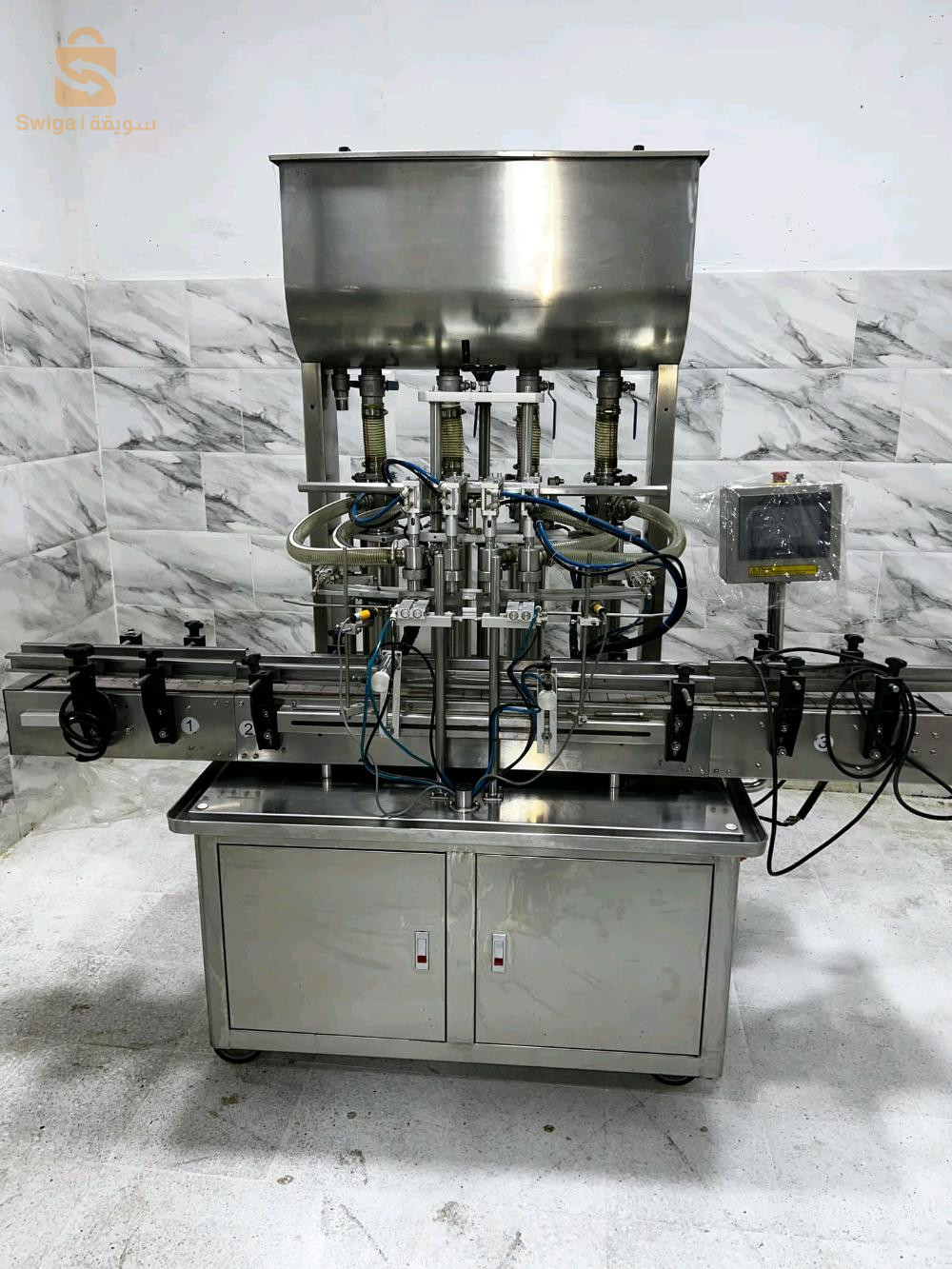 Rempliseuse 4 bec autamatique pour jus lait produi etergent champo et tt les produi likidكل أنواع السوائل M 100 ml.   1000 ml1200 boteil par heure