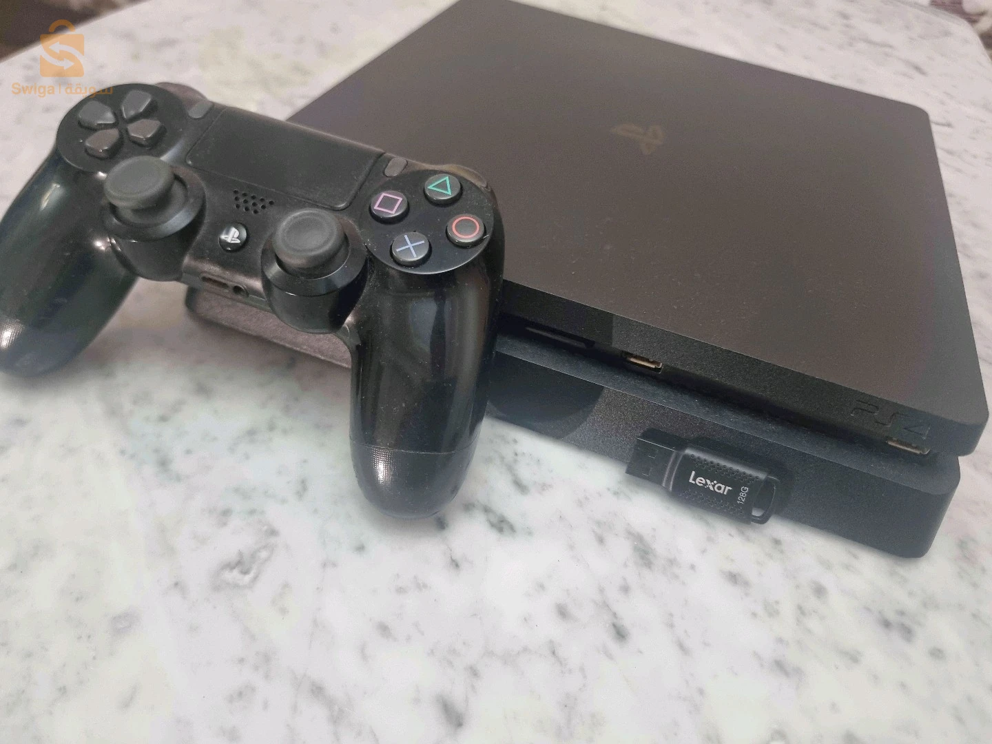 PS4SLIM 1TB مفلاشي12.02 بدون قرص+21لعبة+فلاش ديسك128GB