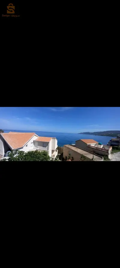 vente un terrain et une  villa à côté de la mer