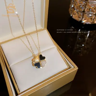 Previous
Next
Collier avec Pendentif Magnétique en forme de Trèfle -Noir et Doré