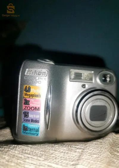 Nikon coolpix 4100 haba nn9ya mafihach chargeur