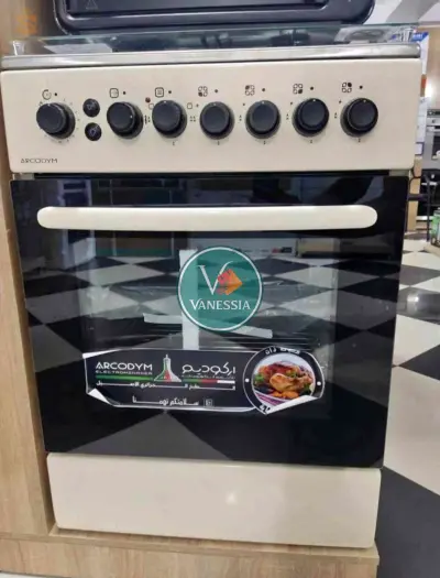 une cuisinière du marque arcodym simple avec trois couleurs (blanc, beige,marron)
