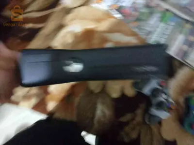 Xbox 360slim 2manet d'origine بالفولو جديدة